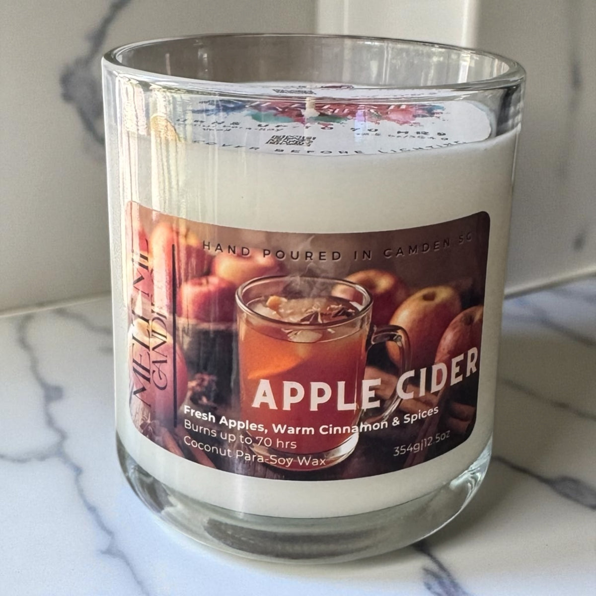 Apple Cider 12.5 oz candle by Melt Me Candle Co in a clear glass jar