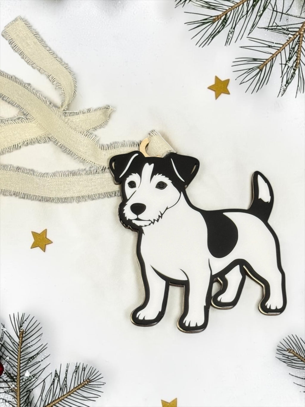 Black and white acrylic Jack Russell Terrier ornament on a festive white background