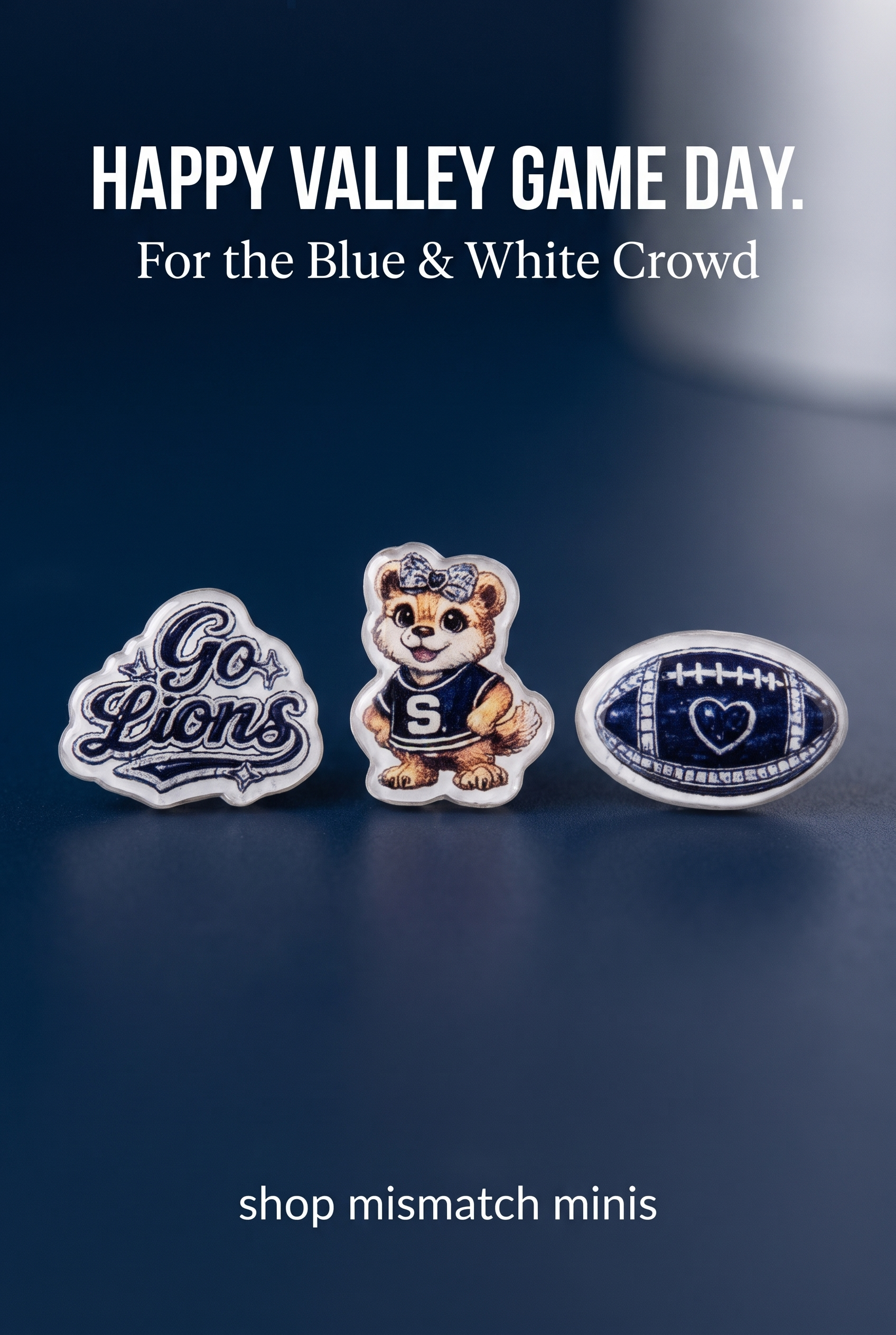 Three blue-and-white acrylic stud earrings displayed on a dark navy promotional background with the headline 'HAPPY VALLEY GAME DAY.' and the phrase 'For the Blue & White Crowd'.