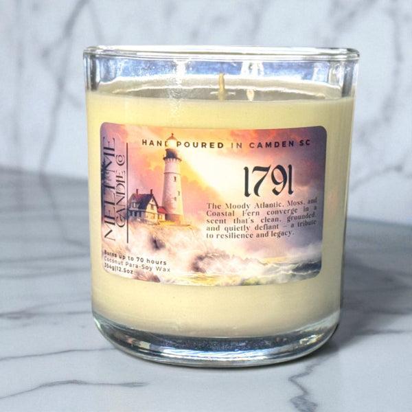Candle with a '1791' label on a marble surface