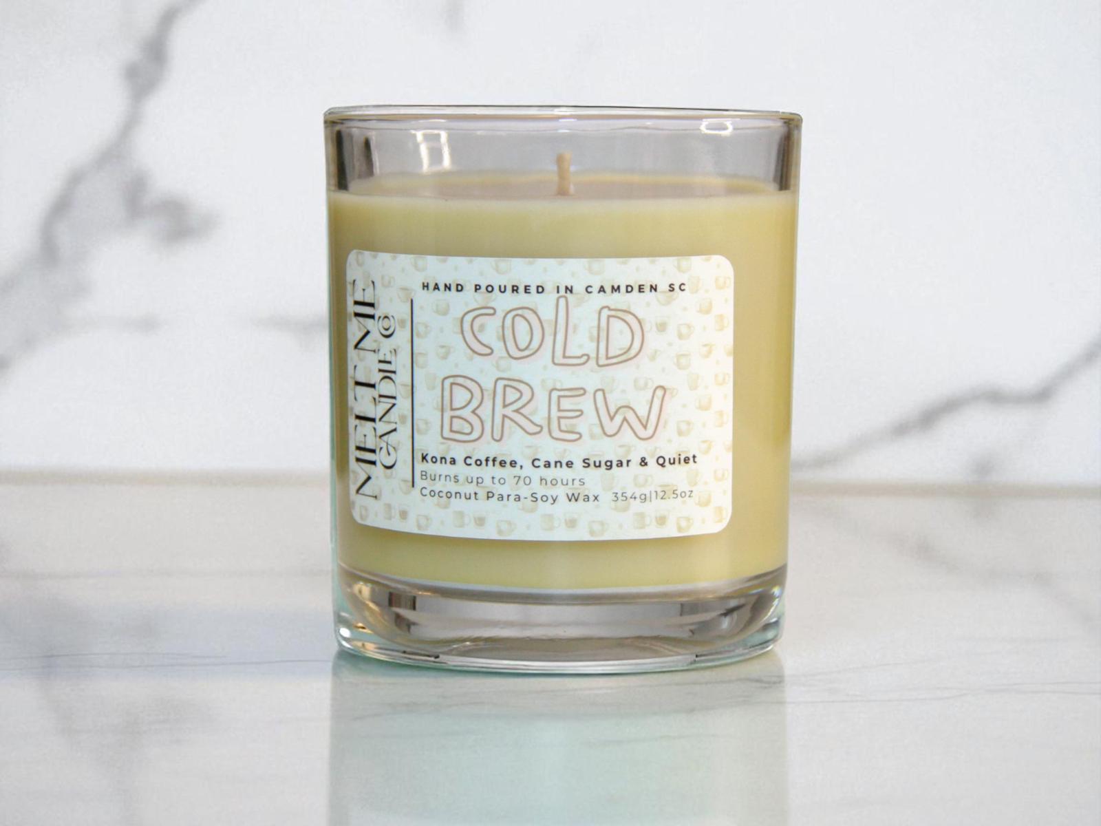 Candle with a 'Cold Brew' label on a marble surface