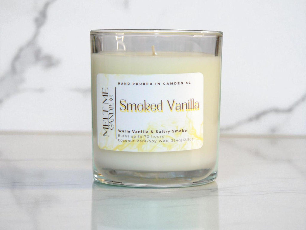 Candle labeled 'Smoked Vanilla' on a marble surface