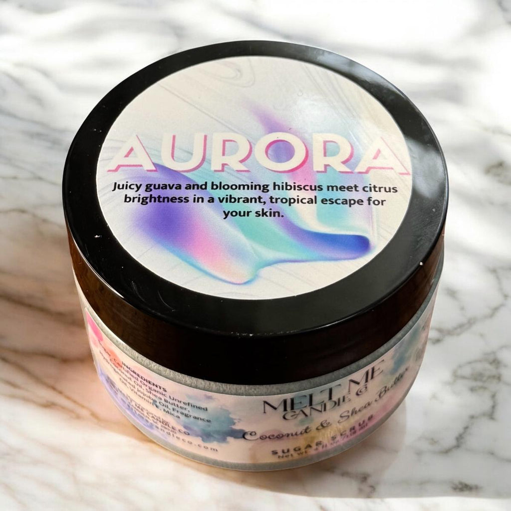 Jar of body scrub with 'Aurora' label on a marble surface