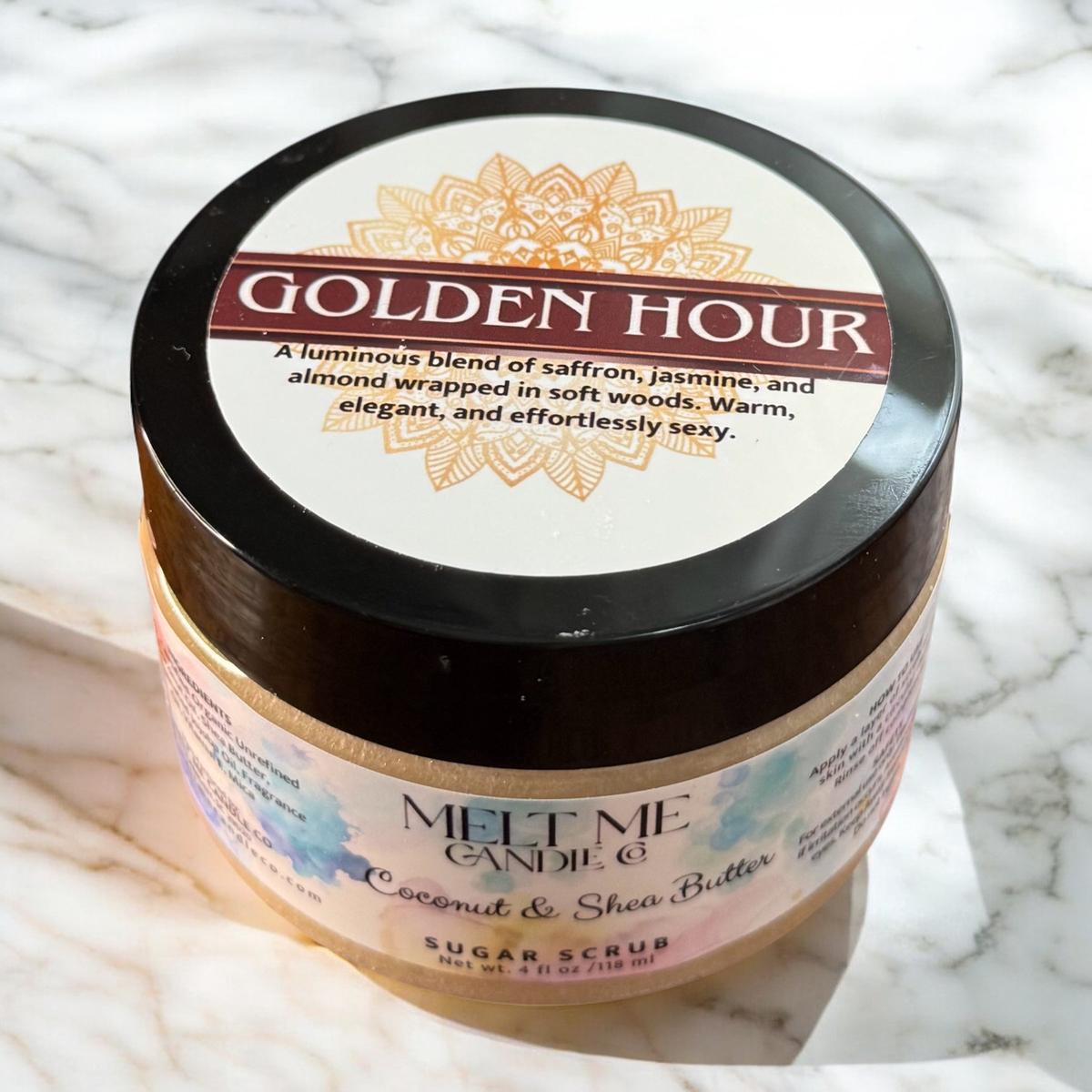 Jar of Golden Hour sugar scrub with decorative label on a marble surface
