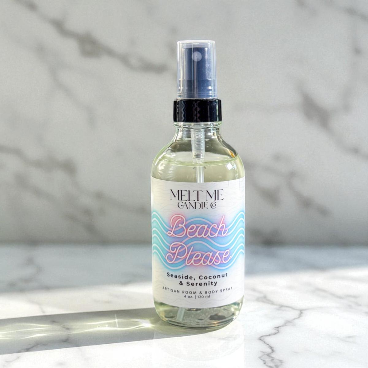 Bottle of 'Beach Please' room and body spray on a marble surface.