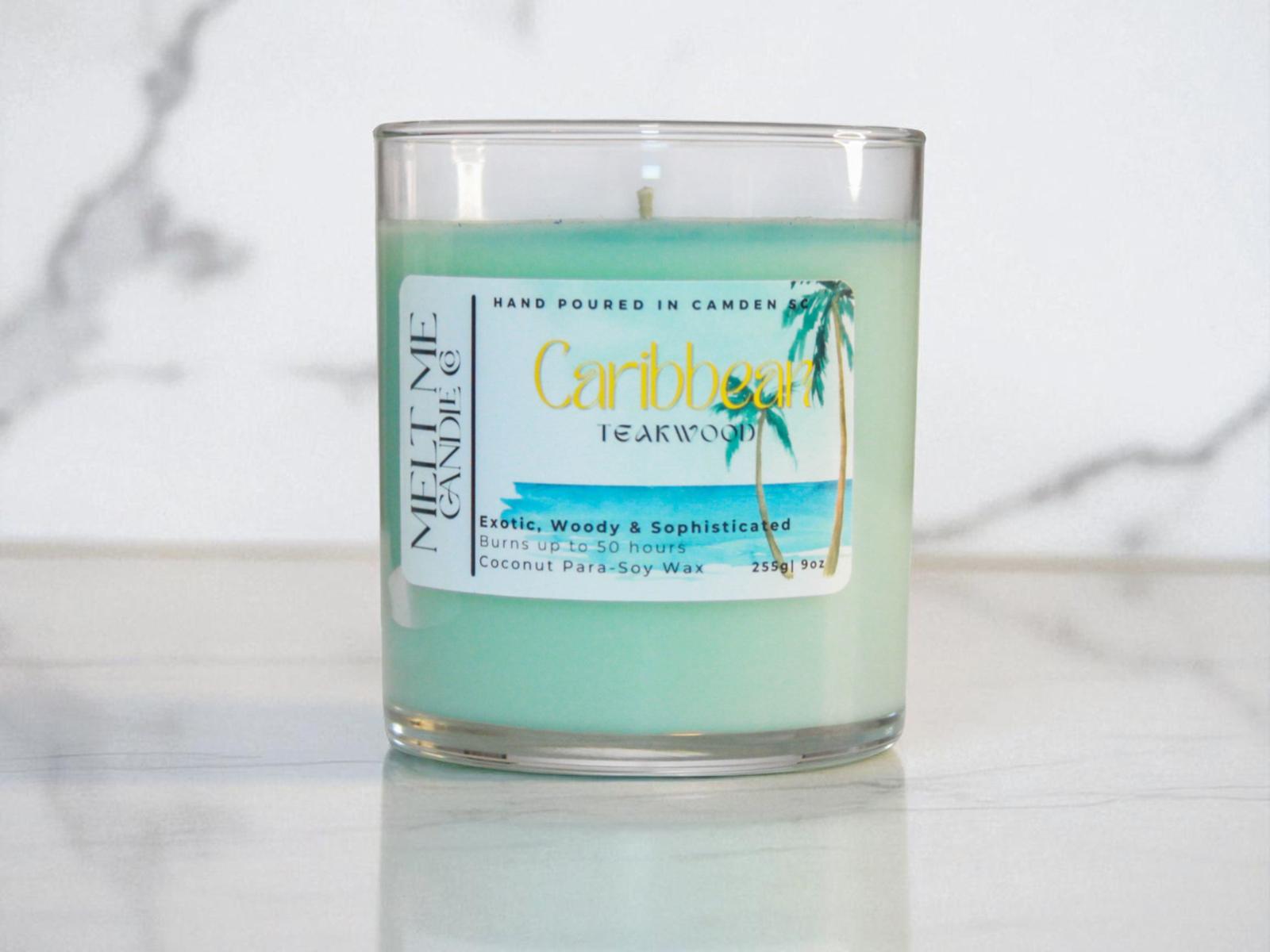 Candle with a 'Caribbean Teakwood' label on a marble surface